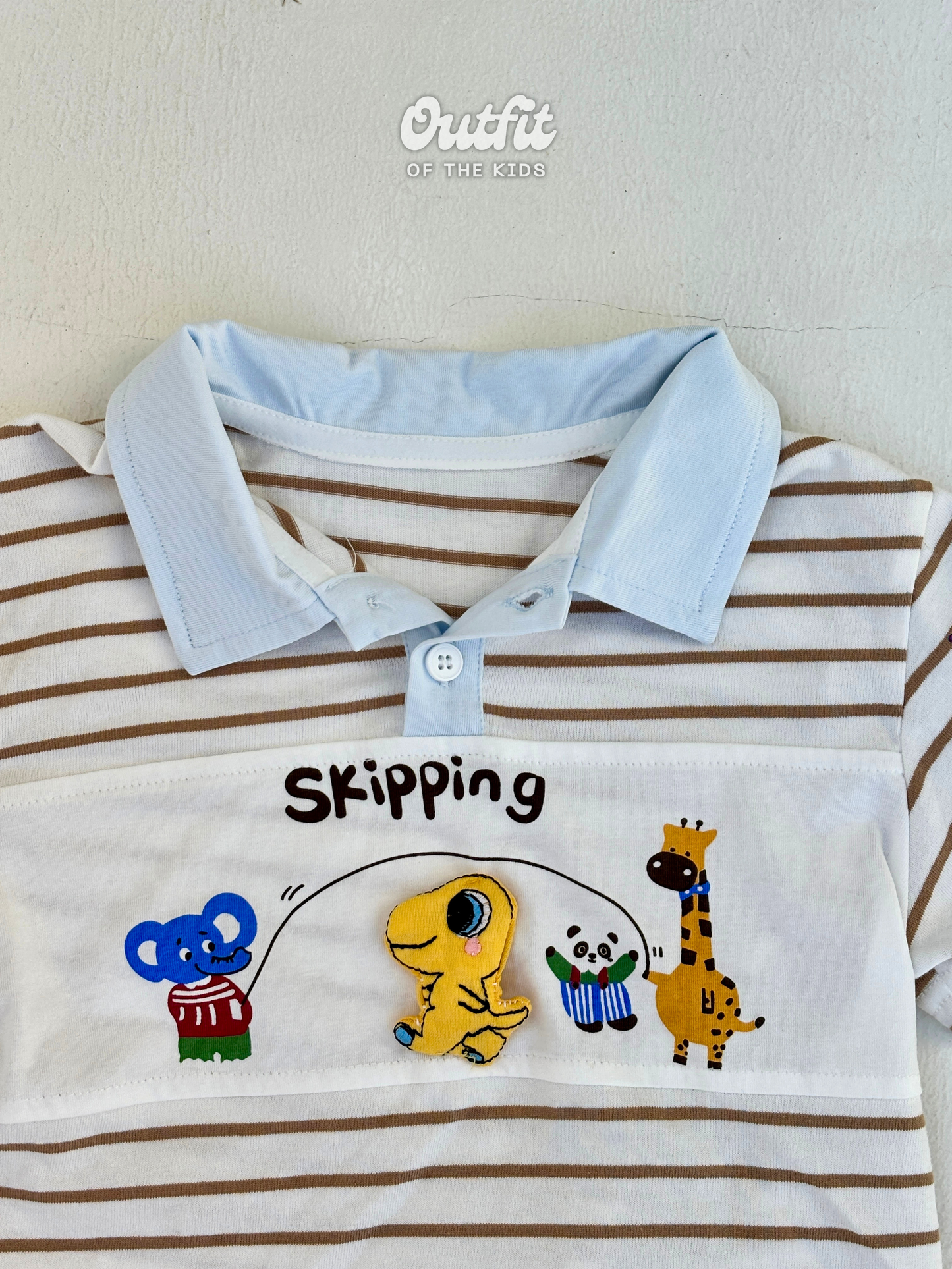 Skipping Dino Polo Top